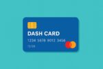 User holding Dash card while making a payment at a store.