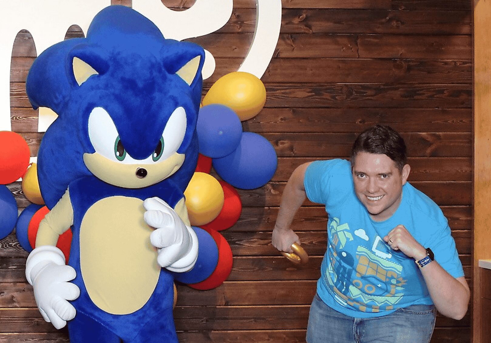Meet and greet events Sonic near me featuring Sonic posing with fans at a vibrant outdoor event.